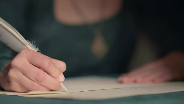 Young woman in renaissance costume writing a letter with a feather quill. Woman writing a letter in historical scene