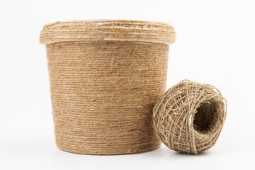 close-up of brown jute twine for DIY and gift wrapping, isolated on white background, concept of zero waste or sustainable lifestyle.