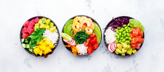 Hawaiian poke bowl set: tuna, salmon, shrimp with avocado, mango, radish, rice and other...