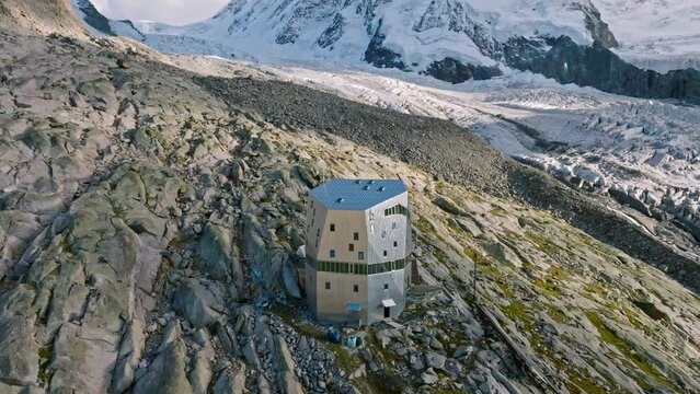 The Monte Rosa hut in Switzerland alps. Drone flight to the right
