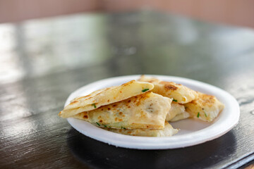 Slices of gozleme with potato on a plate. Turkish street food