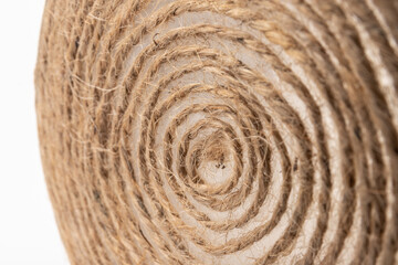 close-up of brown jute twine for DIY and gift wrapping, isolated on white background, concept of zero waste or sustainable lifestyle.