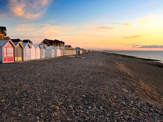 Obraz premium Sunset on the sea with gulls at Cayeux sur Mer, a resort town in the Somme department in Hauts-de-France in northern France. The town is part of the Baie de Somme 