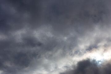 Fototapeta na wymiar Gray dark clouds covered the sun in the sky