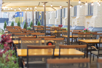 Tables in the summer cafe. Reservation of stalls in a cafe