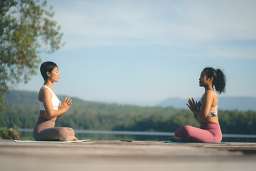 Fototapeta premium beautiful female healthy lifestyle, young sport girl woman person exercise with outdoor yoga of morn nature summer sunrise or sunset, fitness to peace relax meditation of body balance training pose