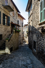 Fototapeta na wymiar View down an old street/alley in Pontremoli, Italy