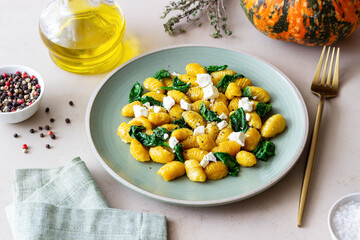 Pumpkin gnocchi with spinach and white cheese. Healthy eating. Vegetarian food.