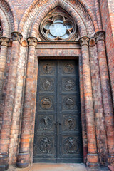 Angels carving on church doors in Berlin, Germany. Detail of the metallic panel on the temple doorway, entrance to the church.