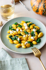 Pumpkin gnocchi with spinach and white cheese. Healthy eating. Vegetarian food.