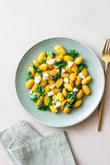 Pumpkin gnocchi with spinach and white cheese. Healthy eating. Vegetarian food.