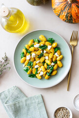 Pumpkin gnocchi with spinach and white cheese. Healthy eating. Vegetarian food.