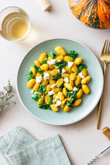 Pumpkin gnocchi with spinach and white cheese. Healthy eating. Vegetarian food.