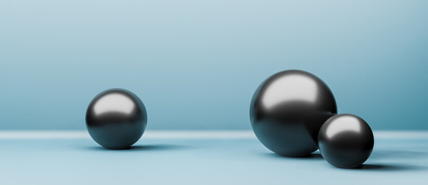 Three shiny black balls or globes in realistic 3D studio interior with copy space for text