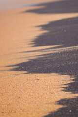 Black and yellow sand combination on the beach 