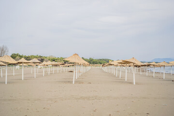Sun umbrellas and deckchairs on the Copacabana beach, part of Great Beach Velika Plaza in Ulcinj. Location: Ulcinj, Montenegro, Balkans, Europe