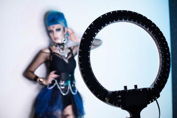 Blogger girl with blue hair and ring lamp