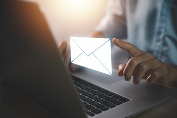 Businessman sending a letter from a laptop. electronic mail concept is online communication on the...