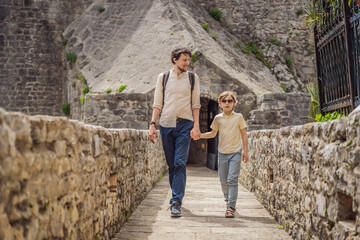 Father and son tourists in Herceg Novi old town. Historical and touristic center of Herceg Novi. Montenegro
