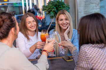Girlfriends toasting in the restaurant