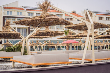 Sun umbrellas and deckchairs on the Copacabana beach, part of Great Beach Velika Plaza in Ulcinj. Location: Ulcinj, Montenegro, Balkans, Europe