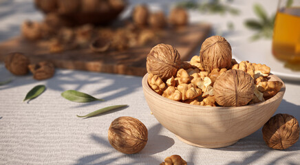 Bunch of walnuts in a wooden plate on white table