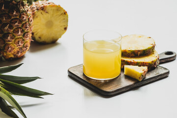 Fototapeta na wymiar fresh pineapple juice glass cut