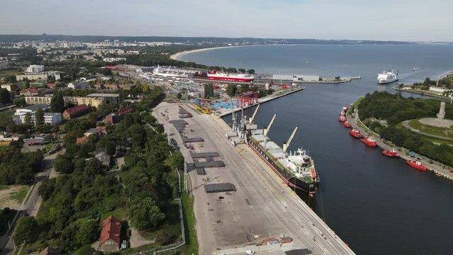 Aerial view of the New Port in Gdansk ,ships ,port canal and the gulf of Gdansk on a summer ,sunny day 8 september 2022