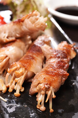A plate of enoki mushroom fatty beef rolls