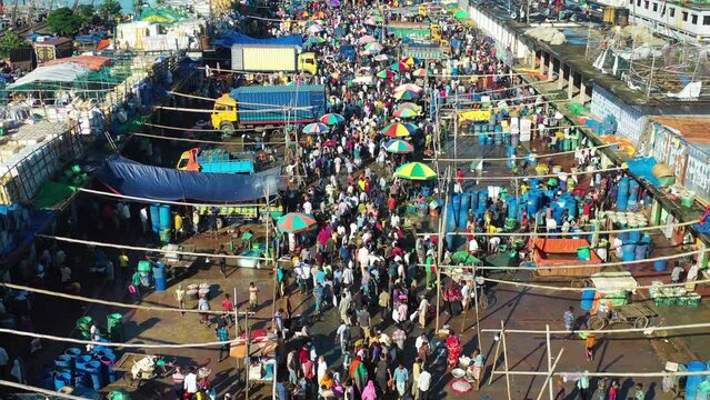 Chittagong, Bangladesh - 24 October 2022: Aerial view of people at local fish market in Chittagong, Bangladesh.