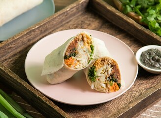 Black sesame sauce vegan pancakes roll with napkin served in dish isolated on table side view of taiwan food