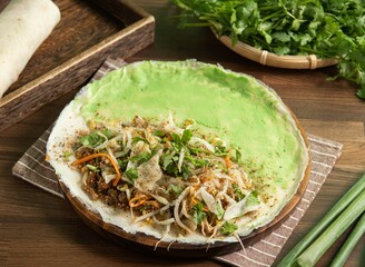 mustard pancakes with napkin served in dish isolated on table side view of taiwan food