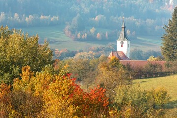 Country church in the village of Dolni Loucky. Colors of Autumn  in Czech Republic.  Colorful sunny autumn morning.