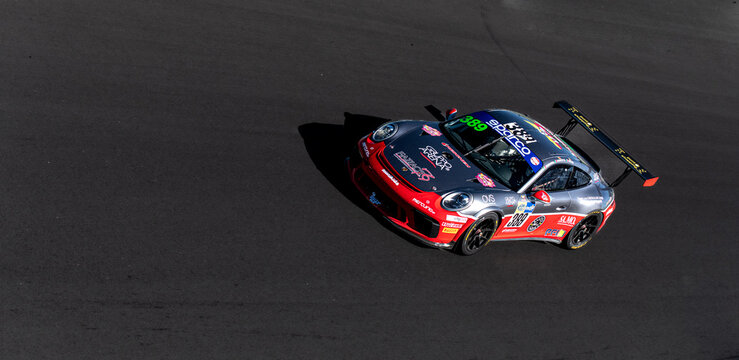 Porsche 991 supercar gt3 action racing on track high angle view copy space