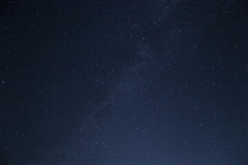 Fototapeta na wymiar Moonlit sky with stars background