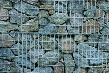 stone background. creative gray texture. colored mosaic. wall made of slabs. brick wall in loft style