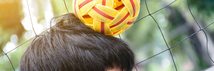Sepak takraw ball controling my head in motion, asian outdoor sports, soft and selective focus,...