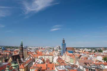 Fototapeta na wymiar Wroclaw's old town, roofs of tenement houses and the Market Square on a sunny summer day. City.