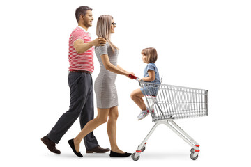 Full length profile shot of a couple pushing a shopping cart with their child seated