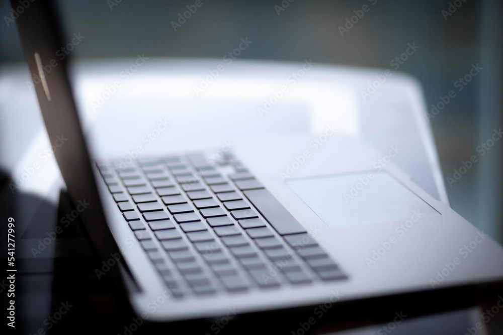 Leinwandbilder close-up of the keyboard of an open laptop ready to work on the table. side view, selective focus on