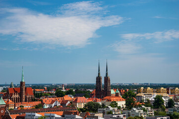 Fototapeta premium Wroclaw's old town, roofs of tenement houses and the Market Square on a sunny summer day. City.