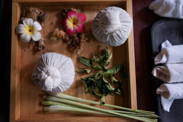 Spice, bean bag and lemon grass on wooden tray