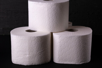 white toilet paper on a black background