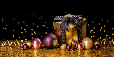 Merry Christmas Happy New Year! Gift in a golden box with a bow on a black and gold background
