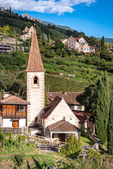 Fototapeta na wymiar St. Magdalena Church in the town of Gratsch or Quarazze near Merano or Meran in the mountains in Etsch Valley in South Tyrol, Sudtirol, Trentino Alto Adige