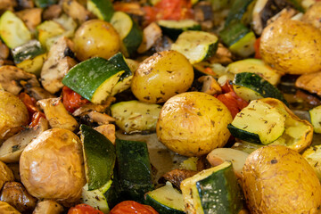 Close up of oven roasted vegetables on a baking tray
