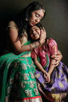 Mom and daughter portrait in traditional wear