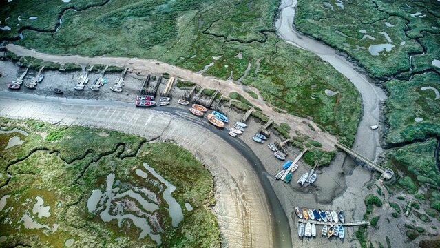 Aerial view of boats moored at a low tide on a dry river in rural Morston, Norfolk