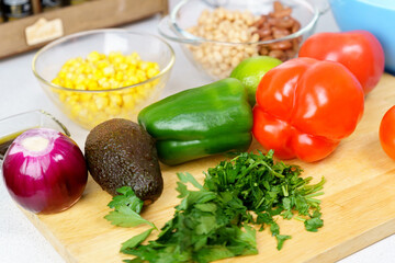 Salad texas caviar. Vegetable dish with corn, beans, pepper, pepper, tomatoes, beans. Served with corn chips nachos. Raw foods, ingredients