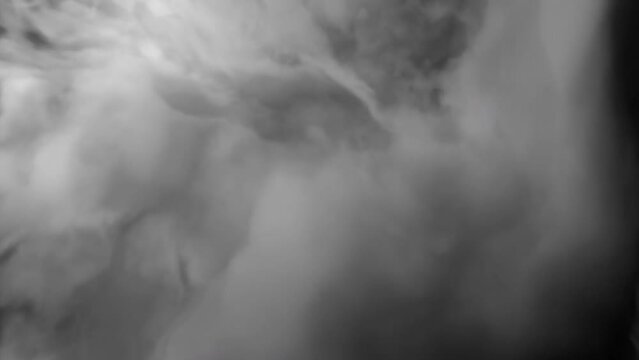 Flying through beautiful stormy thick fluffy clouds. Design. Amazing abstract clouds moving slowly with flashing lightning.